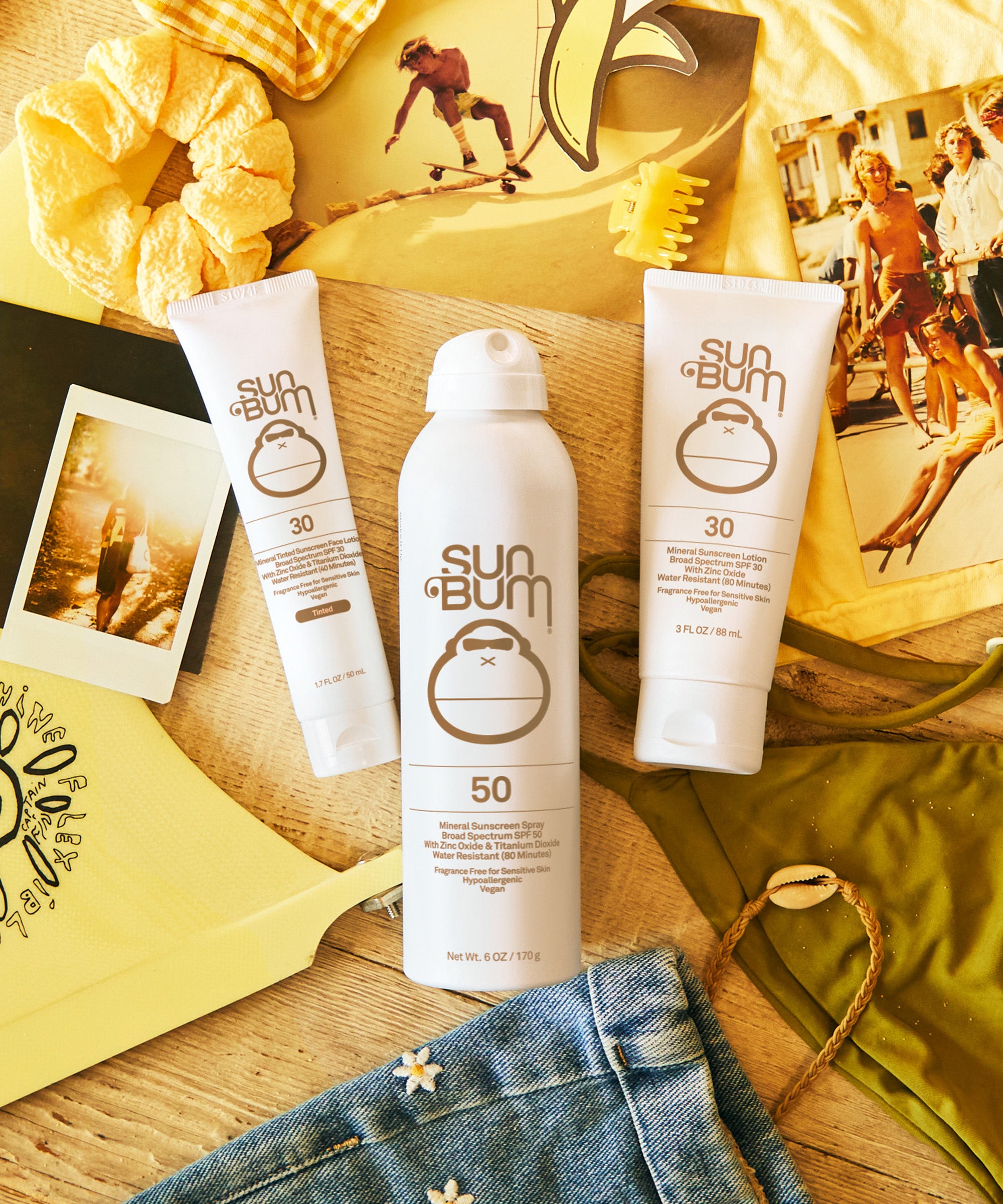 Sun Bum sunscreen products on a wooden surface with a casual background