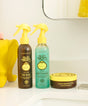 Sun Bum skincare products including sea spray, heat protector, and surf cream on a bathroom counter.