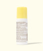 Medication bottle with yellow cap on a white background