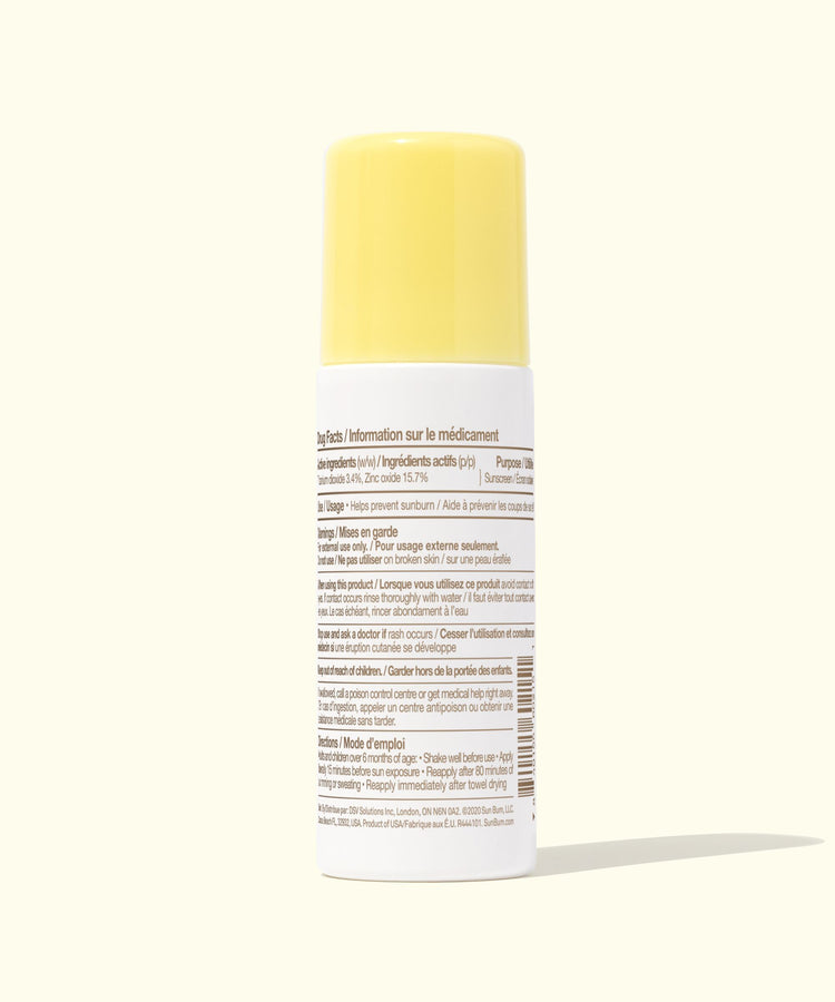 Medication bottle with yellow cap on a white background