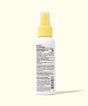 Spray bottle with yellow nozzle on a white background
