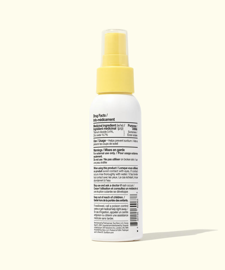 Spray bottle with yellow nozzle on a white background