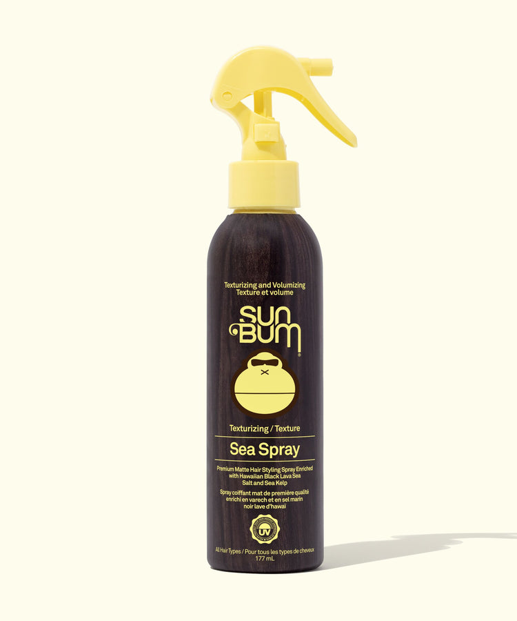 Sun Bum Sea Spray bottle with yellow nozzle on a white background