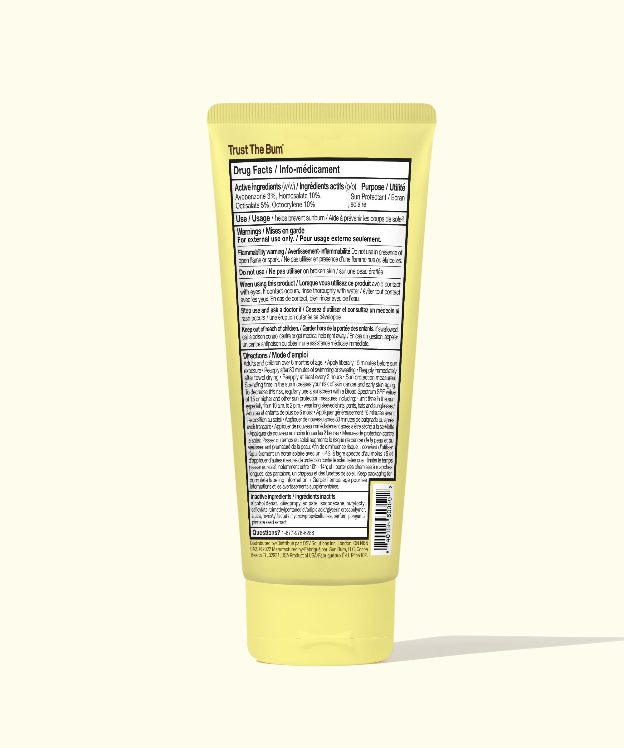 Yellow tube of cream with a label on a white background