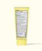 Yellow tube of cream with a label on a white background