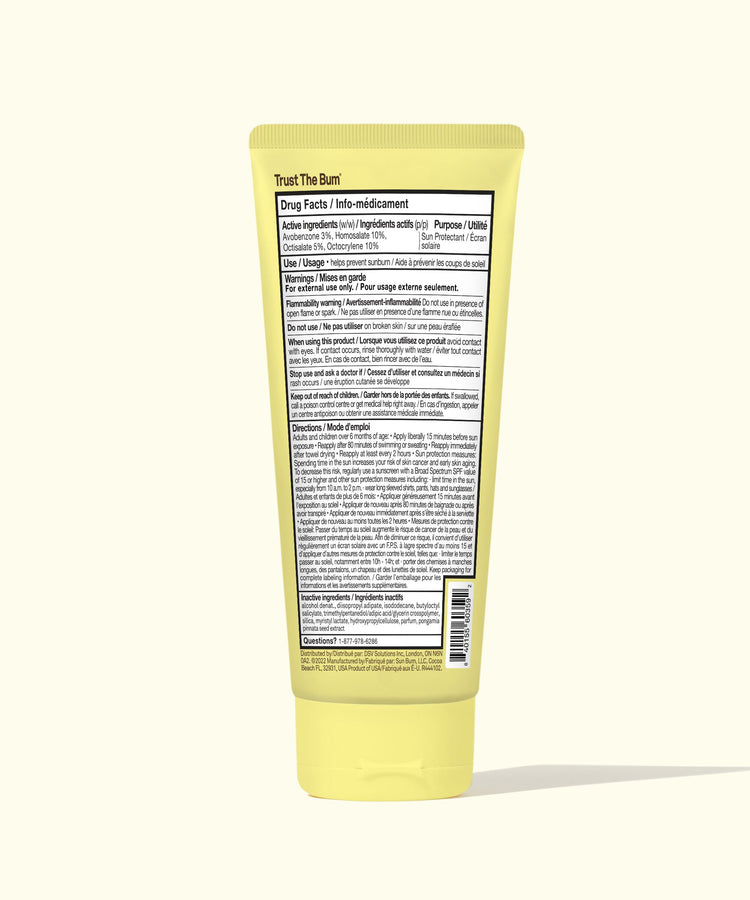 Yellow tube of cream with a label on a white background