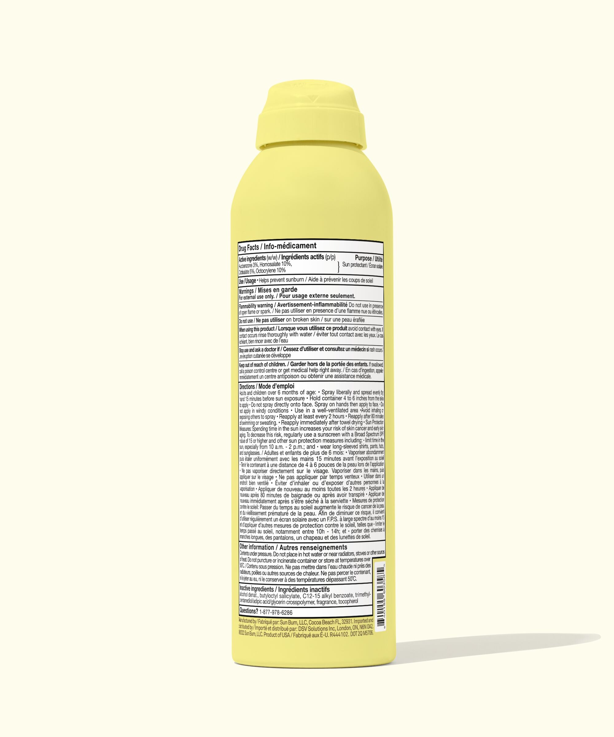 Yellow spray bottle with a label on a white background