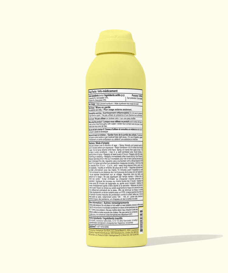 Yellow spray bottle with a label on a white background