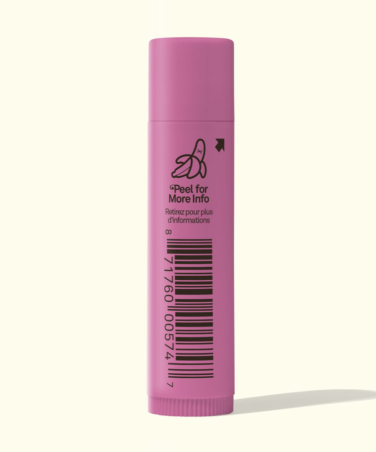 Pink lip balm with barcode and text on a white background