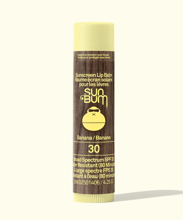Sun Bum sunscreen lip balm tube with banana flavor on a white background