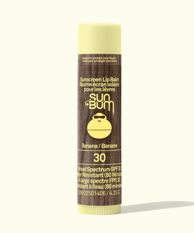 Sun Bum sunscreen lip balm tube with banana flavor on a white background
