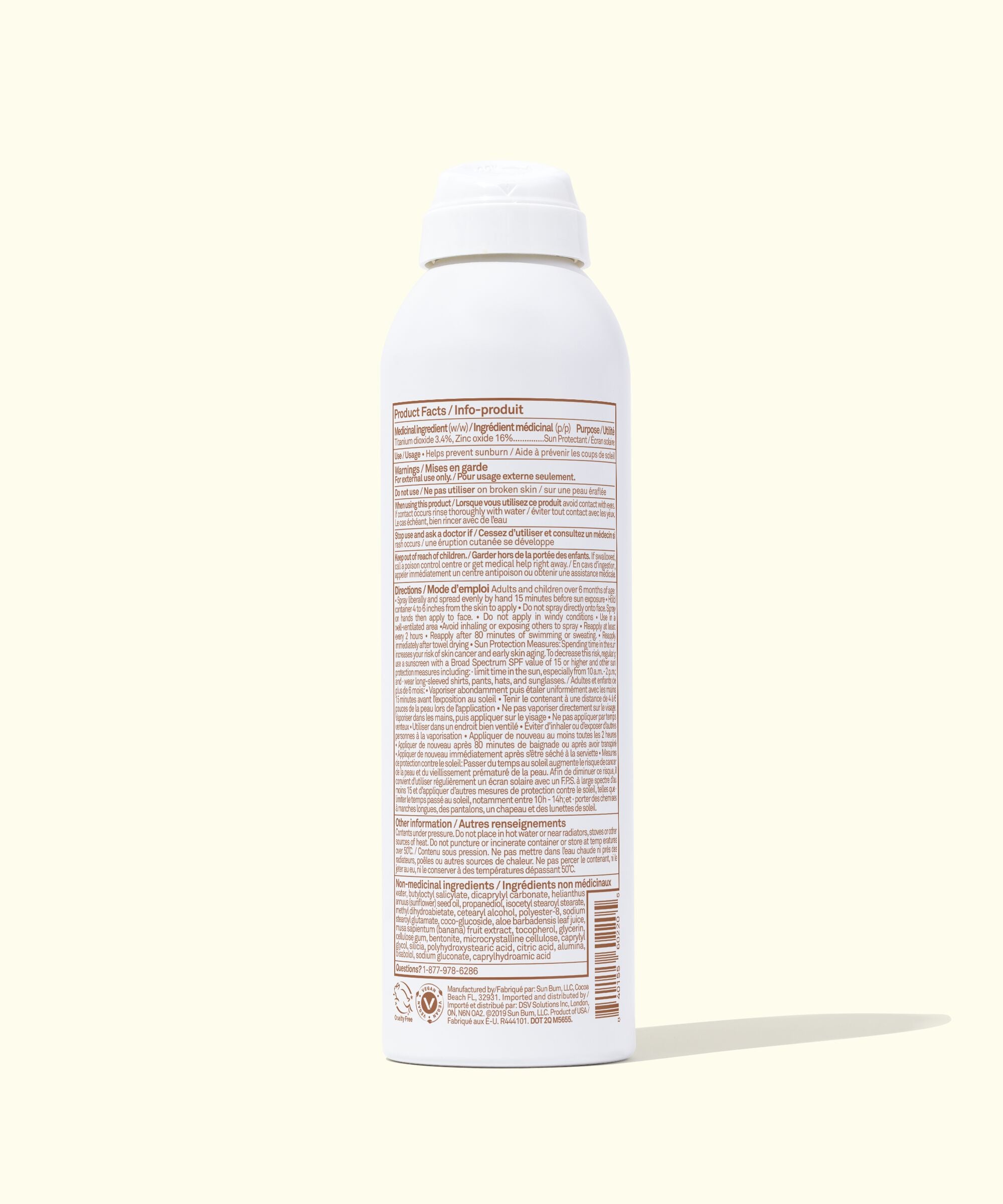 White spray bottle with a label on a white background