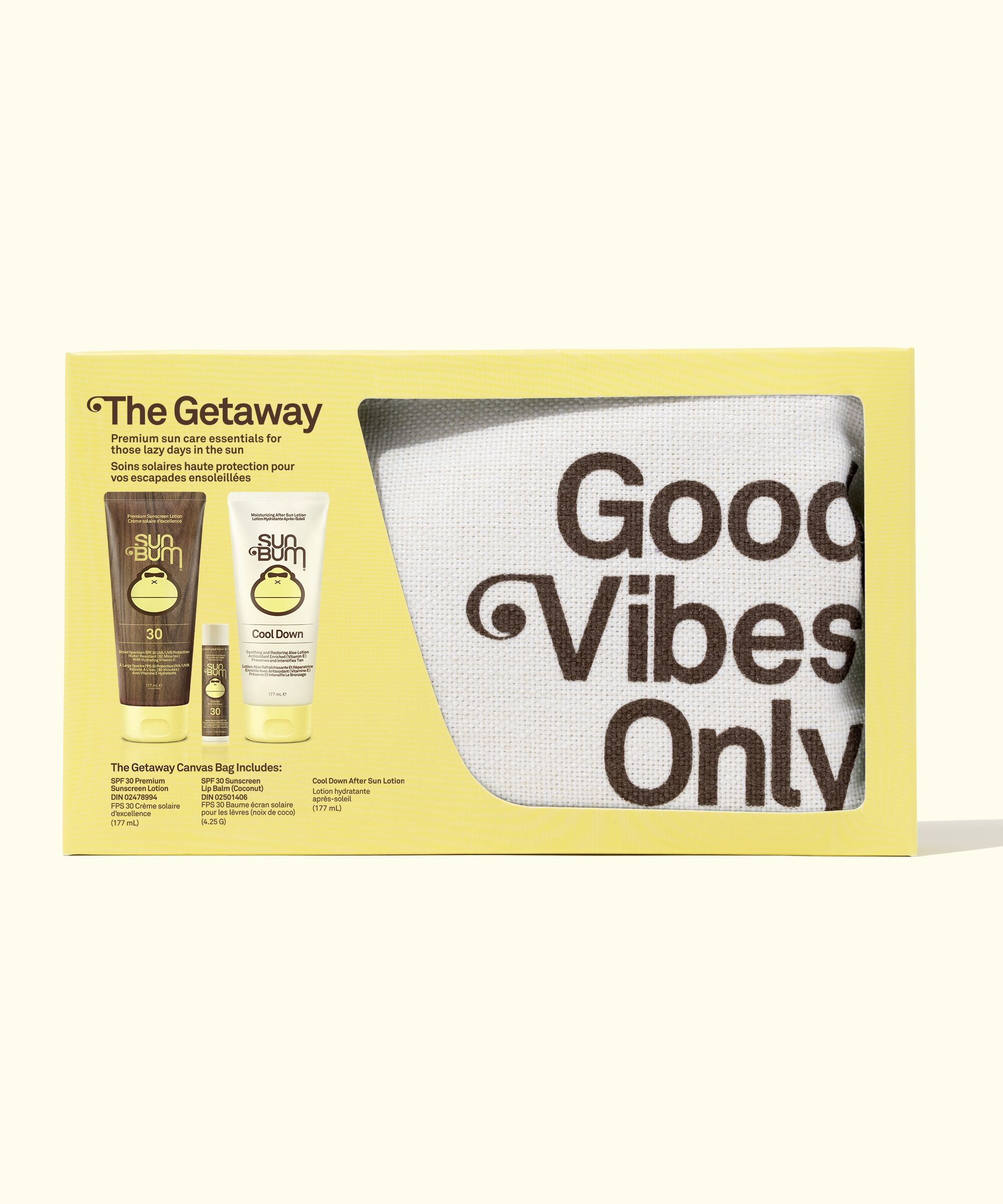 Product set with 'Good Vibes Only' mug and two bottles on a yellow background