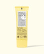 Yellow tube of 'Trust The Bum' body lotion with text on a white background