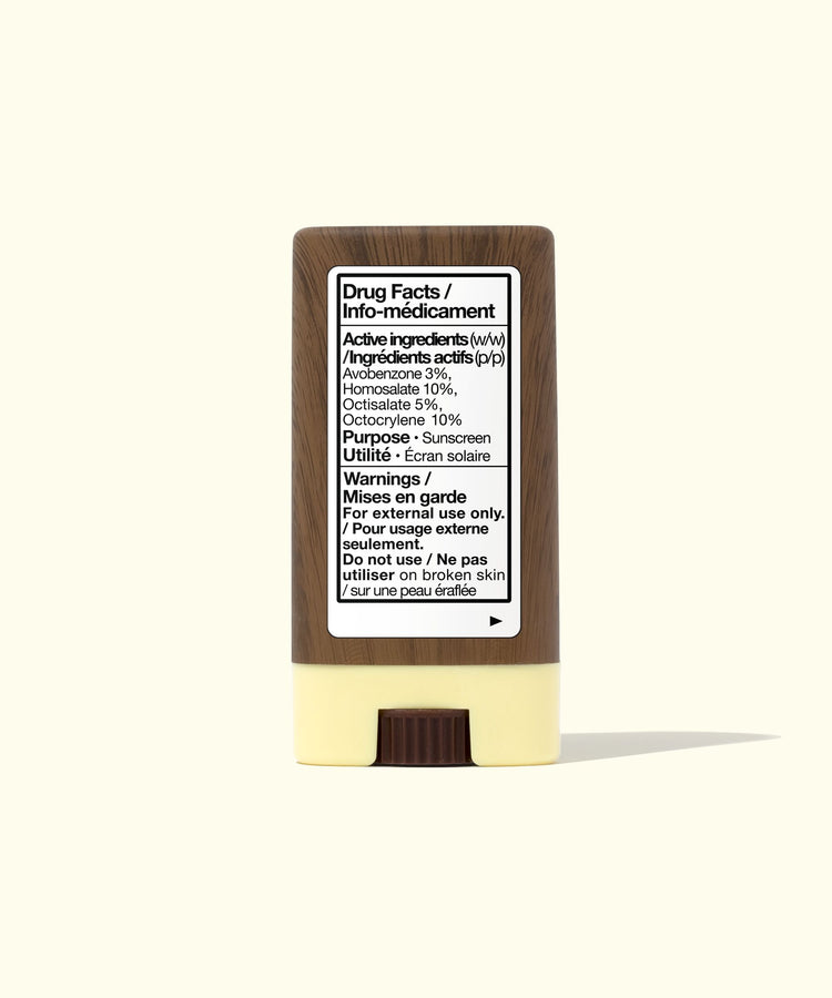 Sunscreen stick with label on a white background