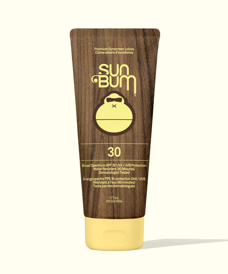 Sun Bum sunscreen lotion tube with brown and yellow design on a white background