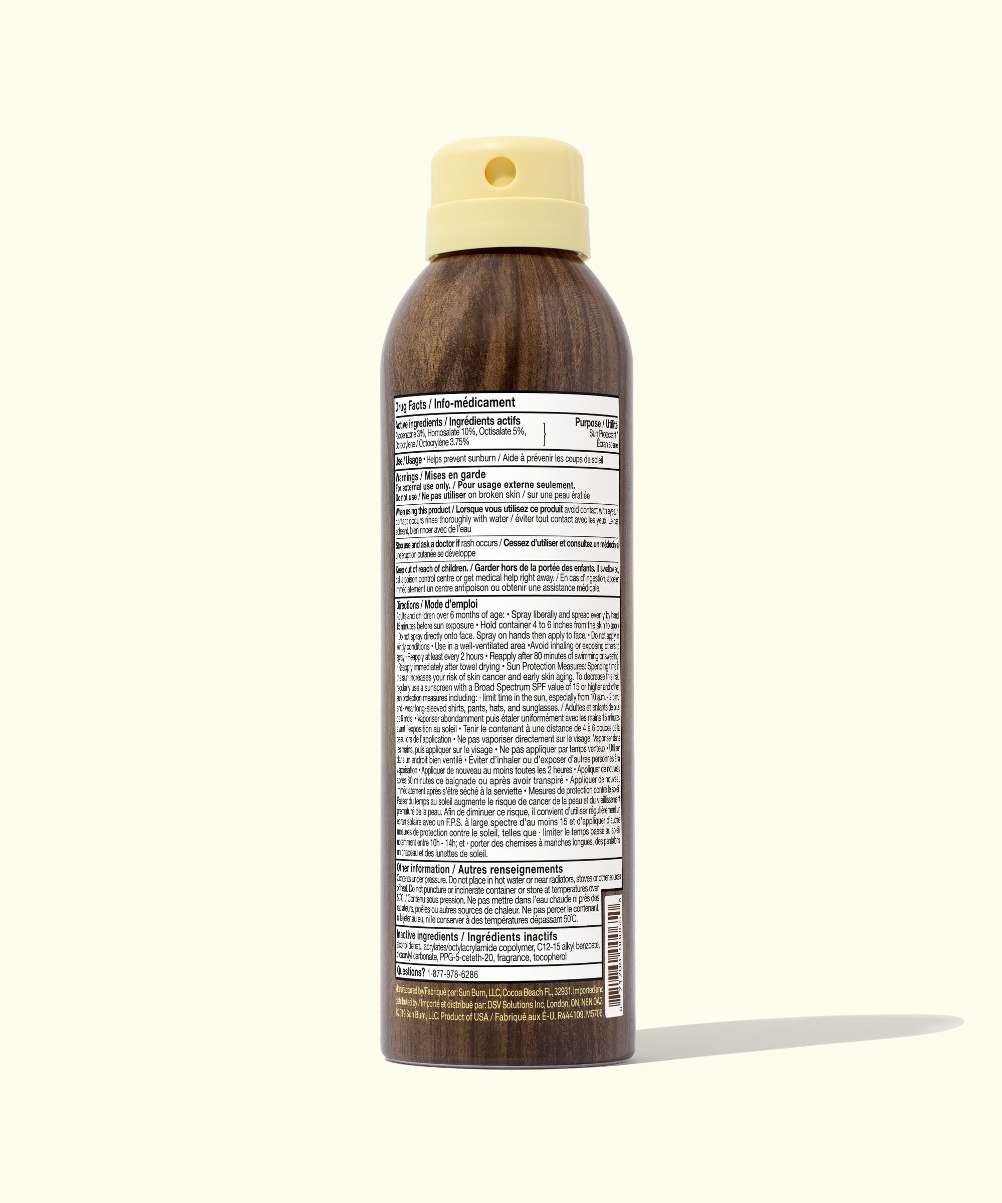 Wooden bottle with a beige cap on a white background