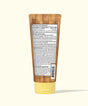 Tub of sunscreen with wooden applicator on a white background