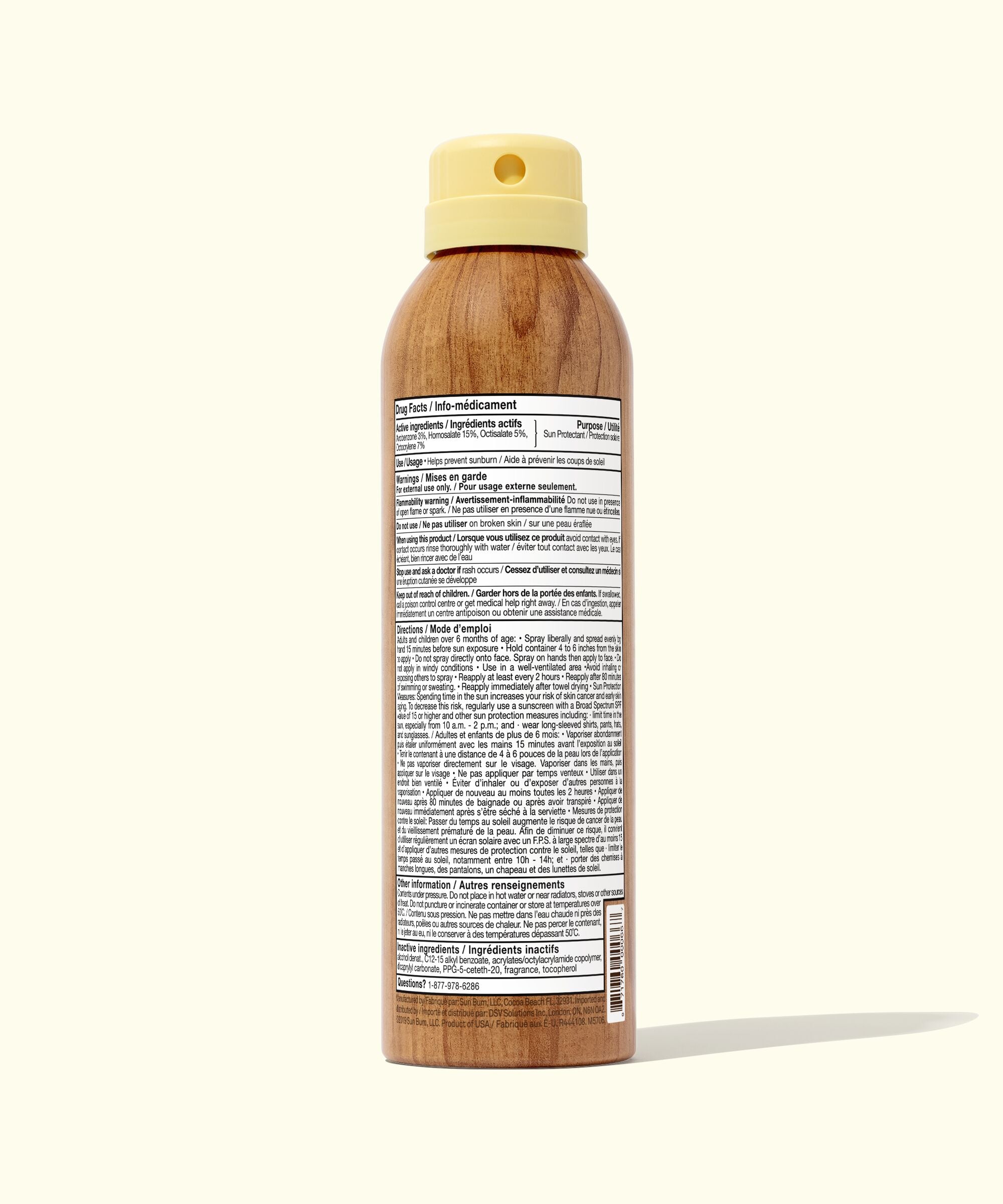 Wooden spray bottle with a beige cap on a white background