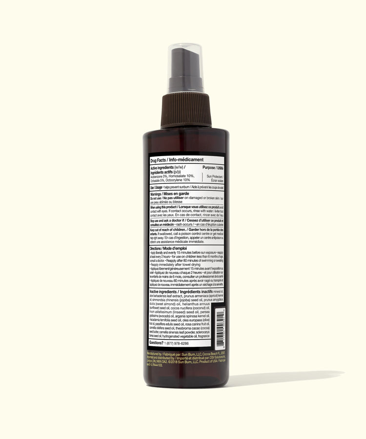 Brown spray bottle with label on a white background