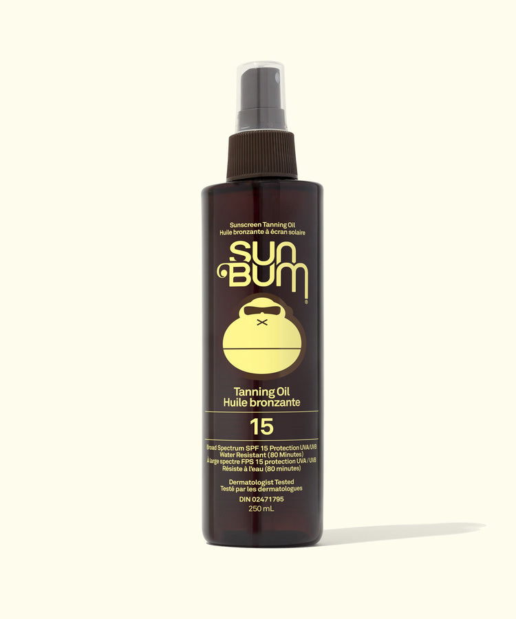 Sun Bum tanning oil spray bottle on a white background
