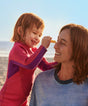 Woman and child on a beach with ocean view