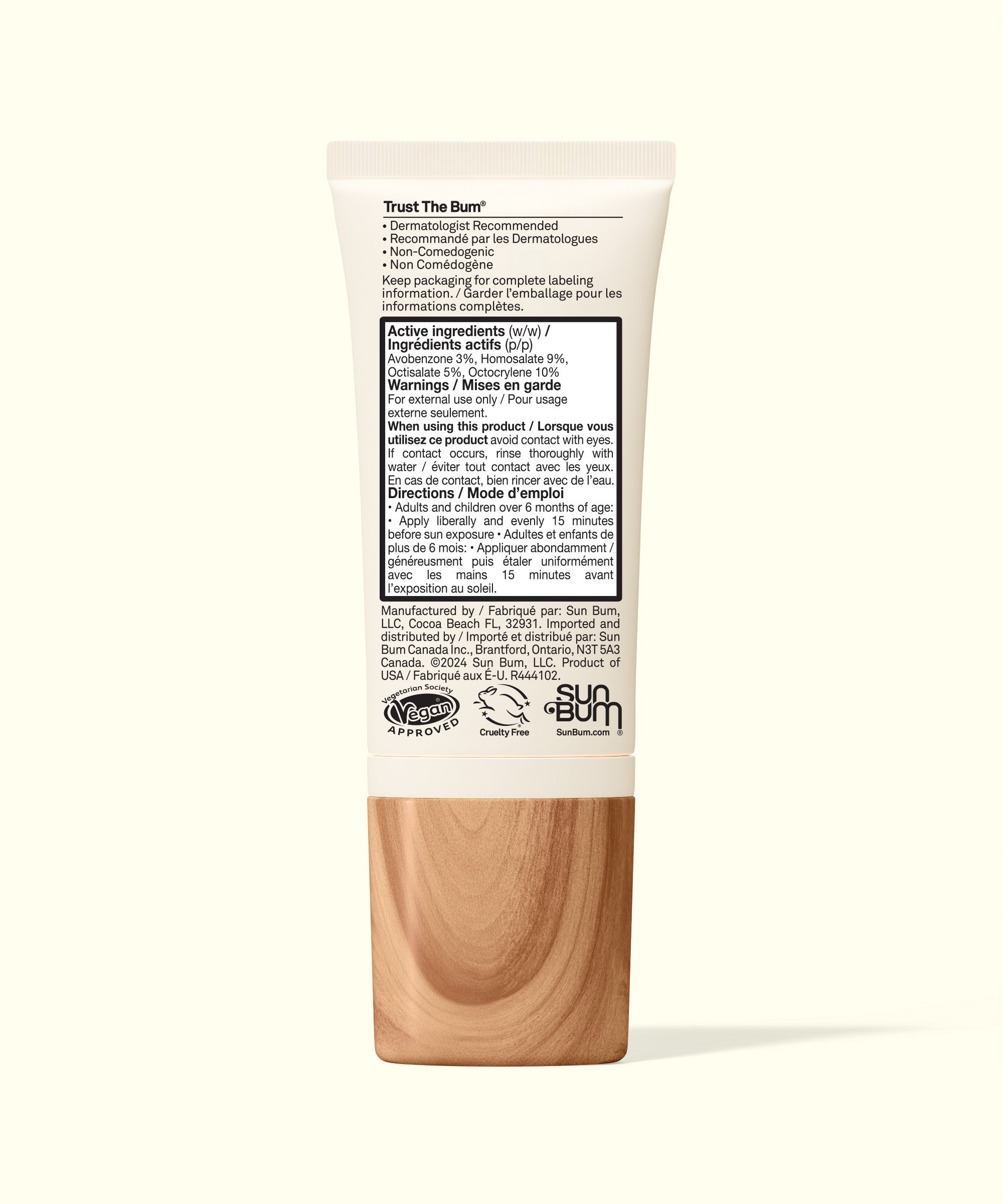 Sun Bum Daily Face Lotion 50 with wooden applicator on white background