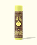 Sun Bum sunscreen lip balm tube with yellow cap on a white background