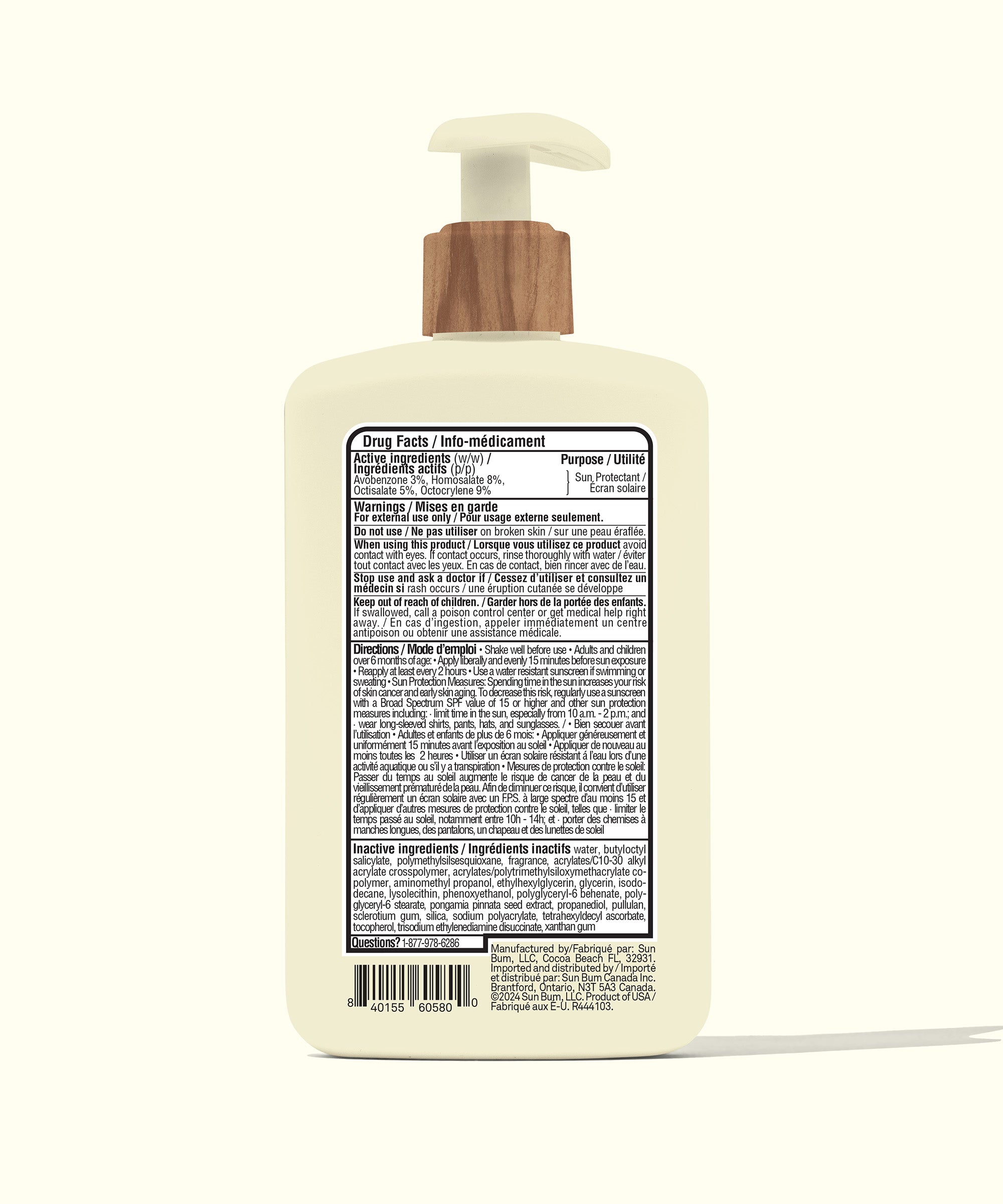Bottle with wooden pump on a white background