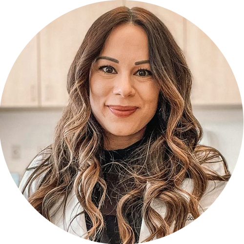 Circular profile picture of a woman with wavy hair.