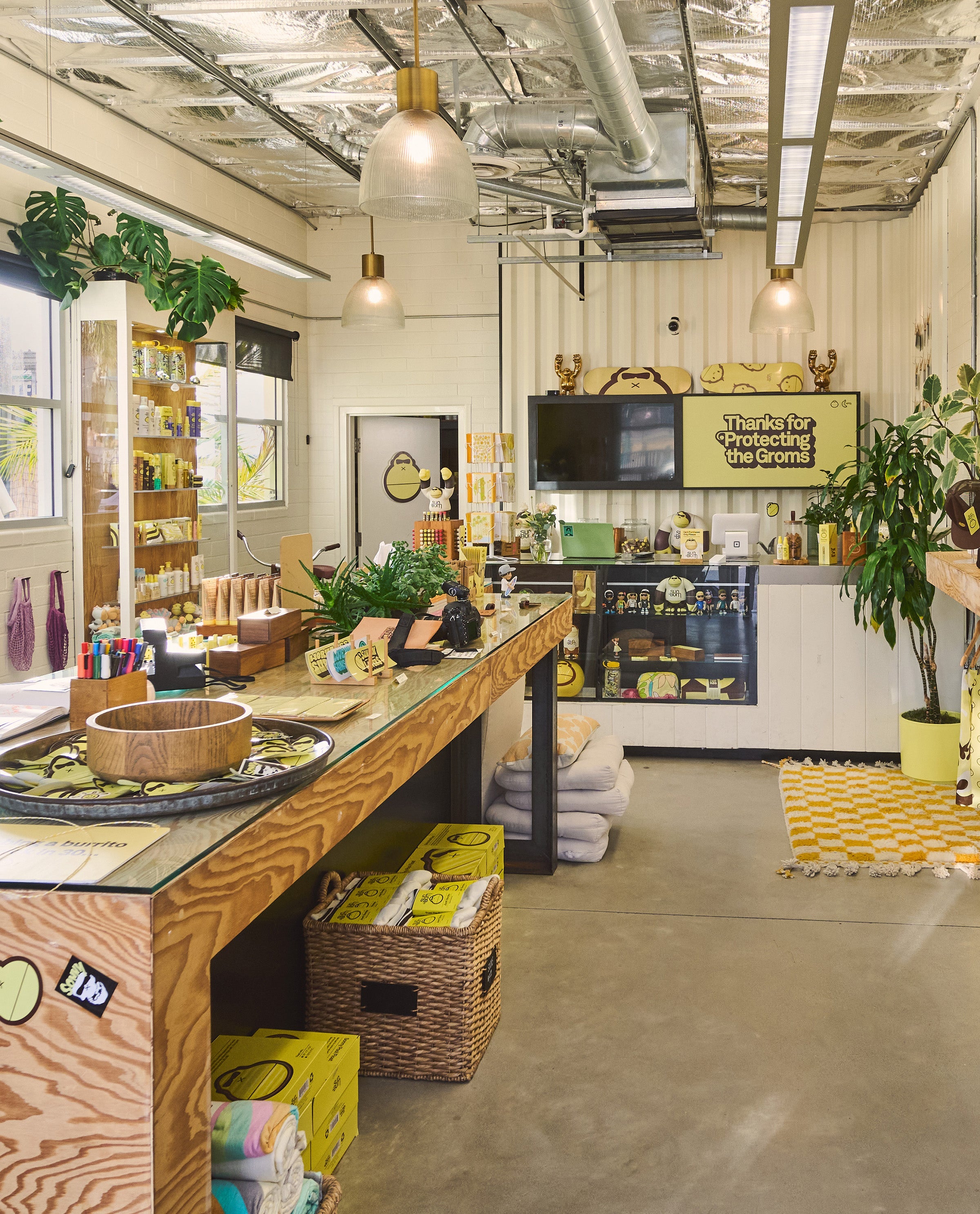 Modern interior of a store with a counter, shelves, and decorative elements.