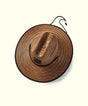 Brown straw hat with black band on a white background